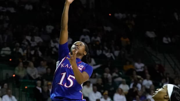 Feb 26, 2022; Waco, Texas, USA; Kansas Jayhawks guard Zakiyah Franklin (15) scores a layup against the Baylor Lady Bears during the first half at Ferrell Center. Mandatory Credit: Chris Jones-USA TODAY Sports